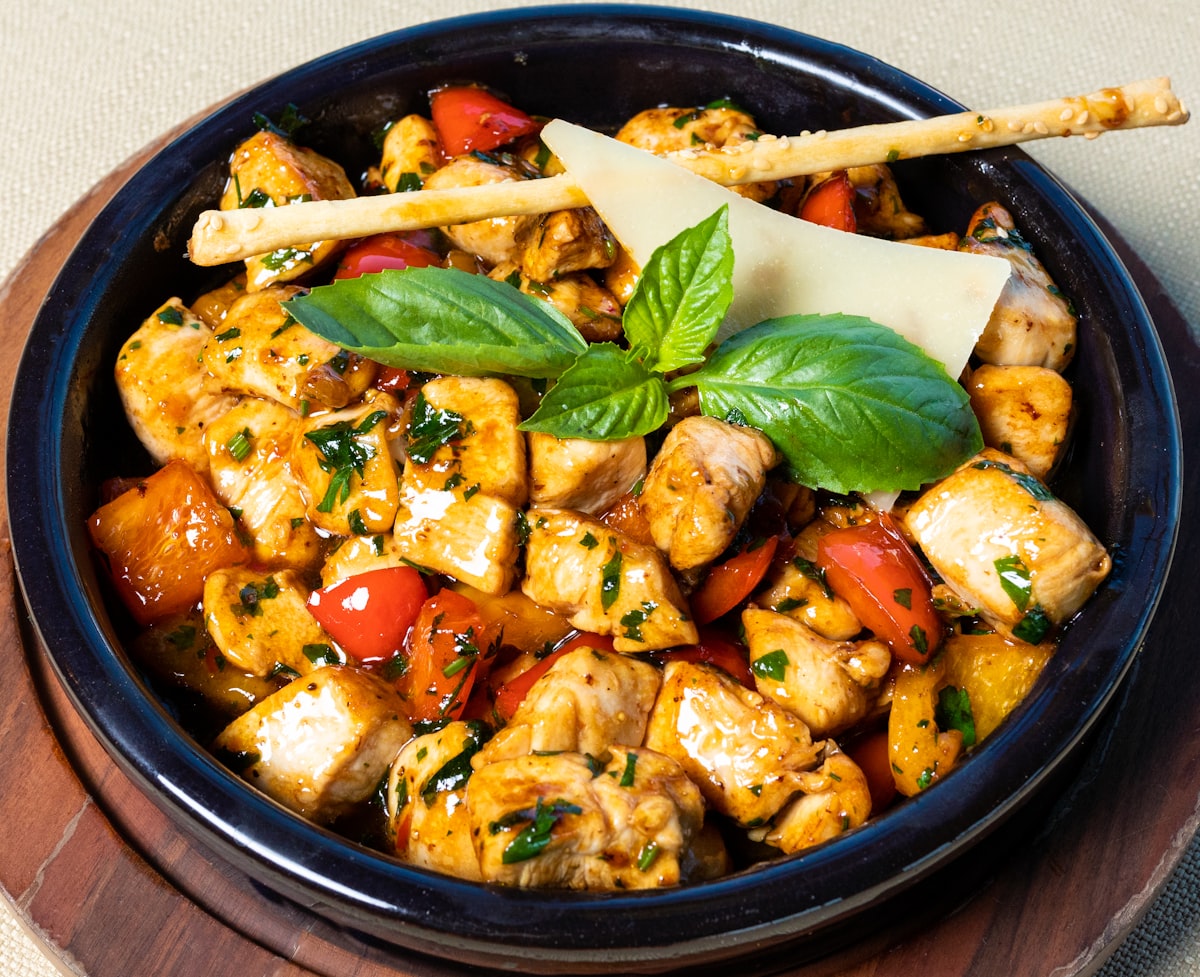 Brown stew chicken with sweet pepper and herbs